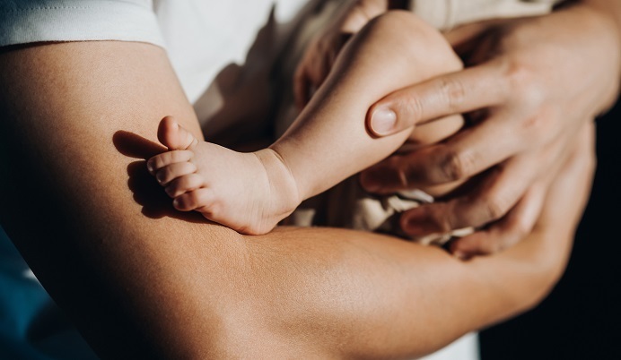 Father holding newborn baby